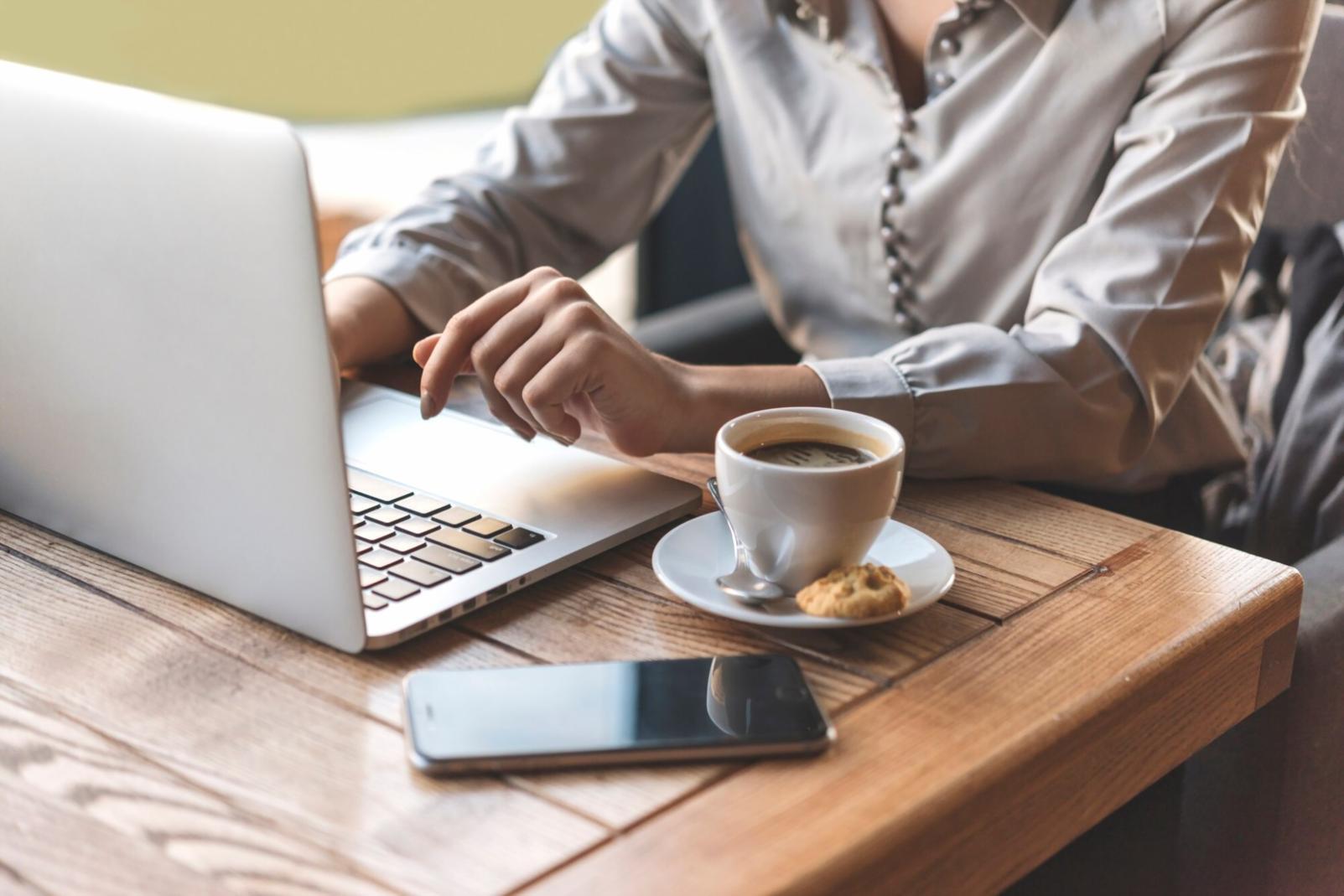 Financial planning workspace with calculator, documents and coffee